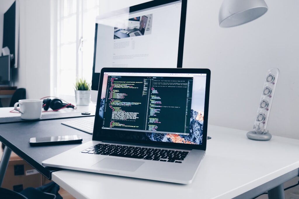 Developer laptop with code on screen